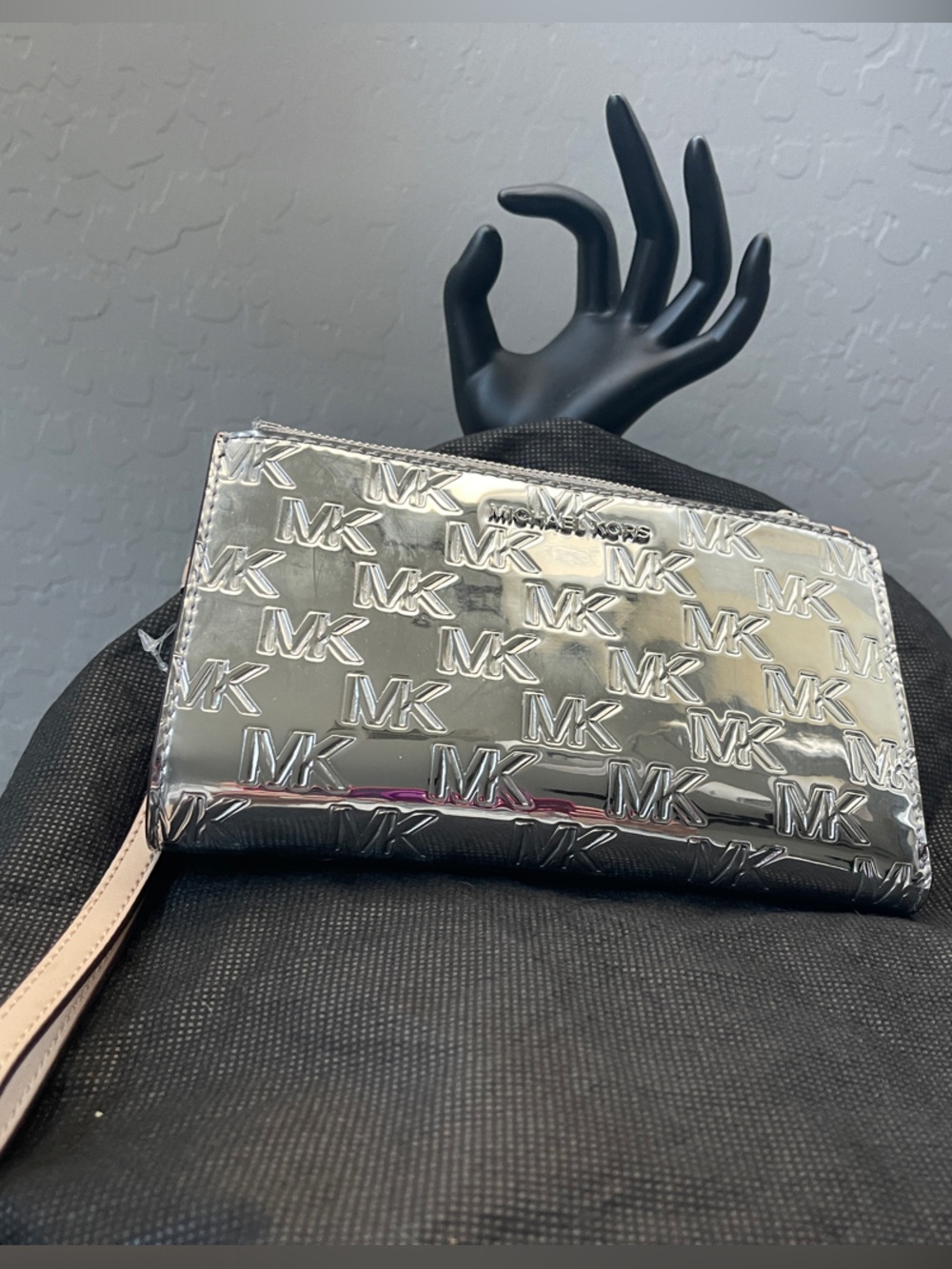 Michael Kors Silver Embossed MK Wristlet with Pale Pink Strap